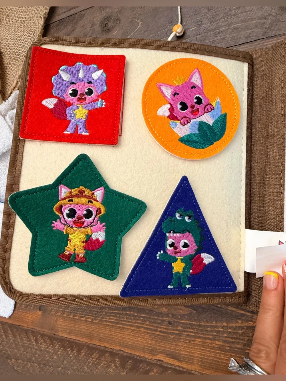 Pinkfong My First Book T-Rex, a Montessori-inspired interactive fabric busy book